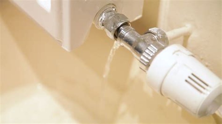 Can you change radiator valve without draining system?