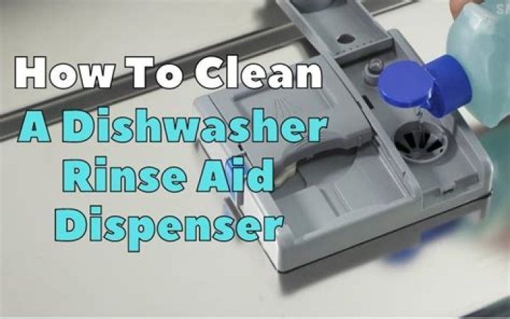 How do you clean a dishwasher rinse aid dispenser?
