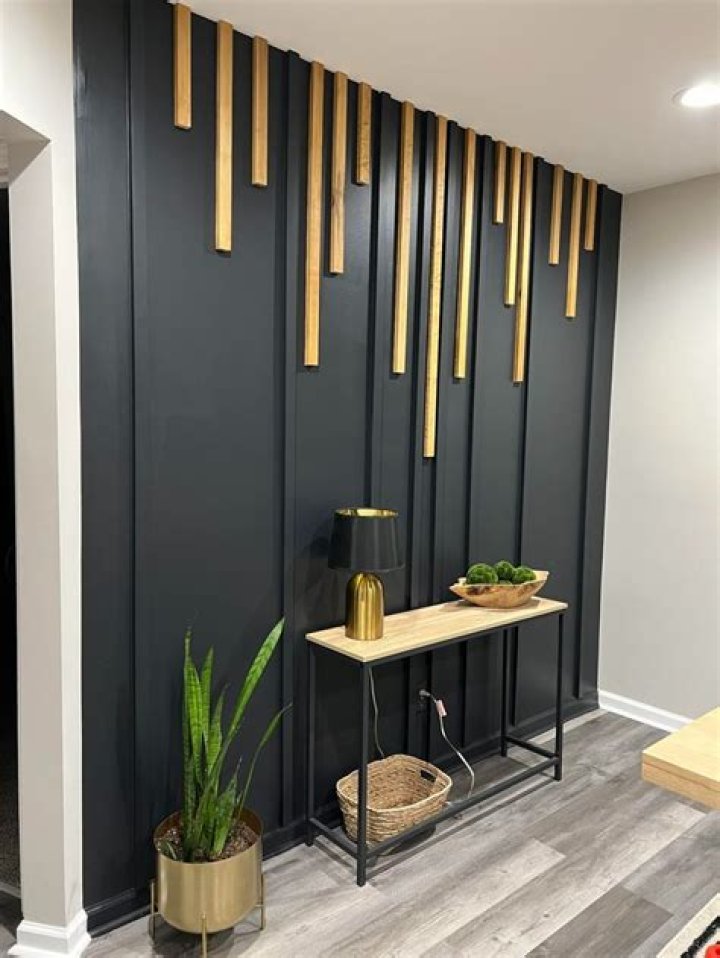 How do you cover a black wall with paint?