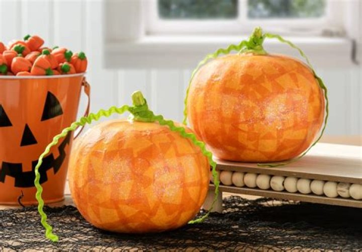 How do you decorate a paper pumpkin?