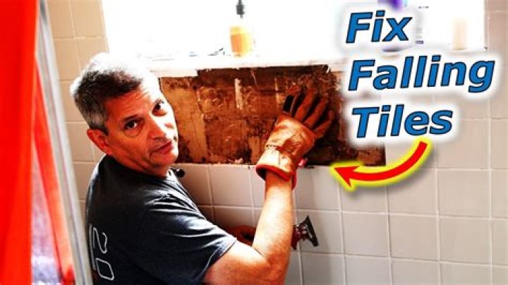 How do you fix a loose tile shower floor?