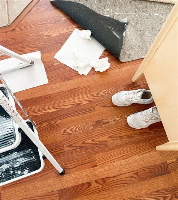 How do you get dried paint off of laminate flooring?