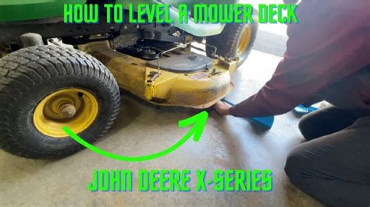 How do you level a John Deere lawn mower deck?
