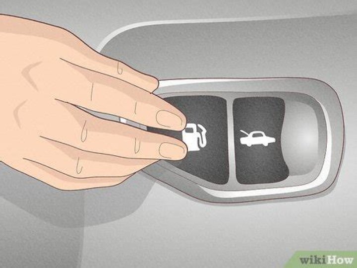 How do you open the gas tank on a 2012 Nissan Altima?