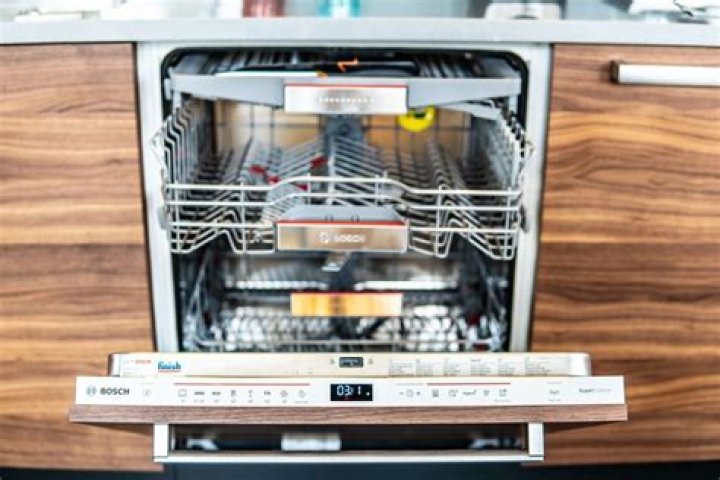 How do you remove the kick plate on a Bosch dishwasher?