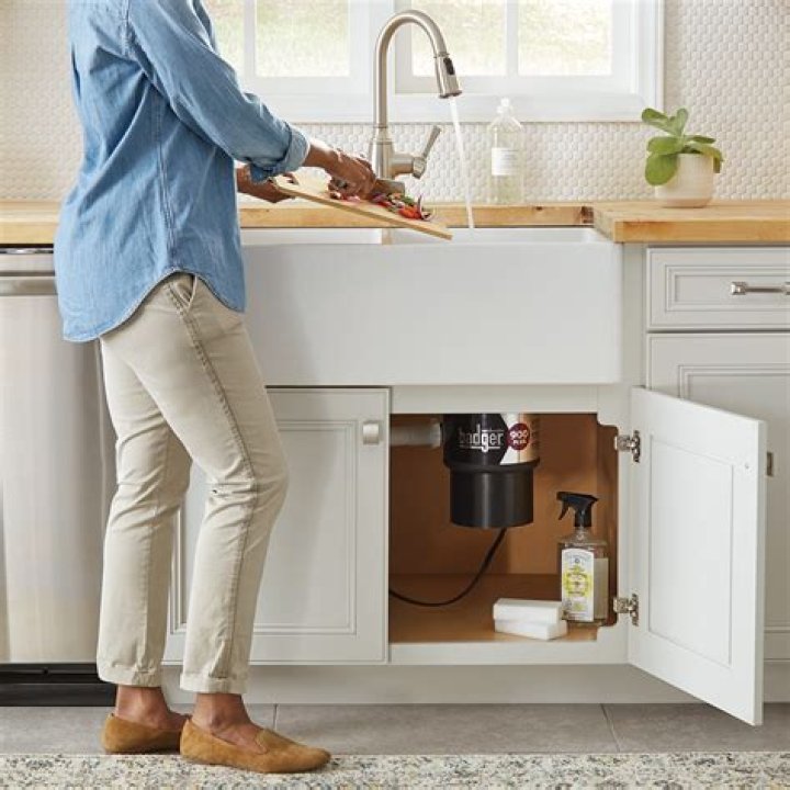 How do you use a garbage disposal in a kitchen sink?