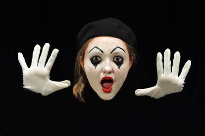 What Colour do mime artists often paint their face?