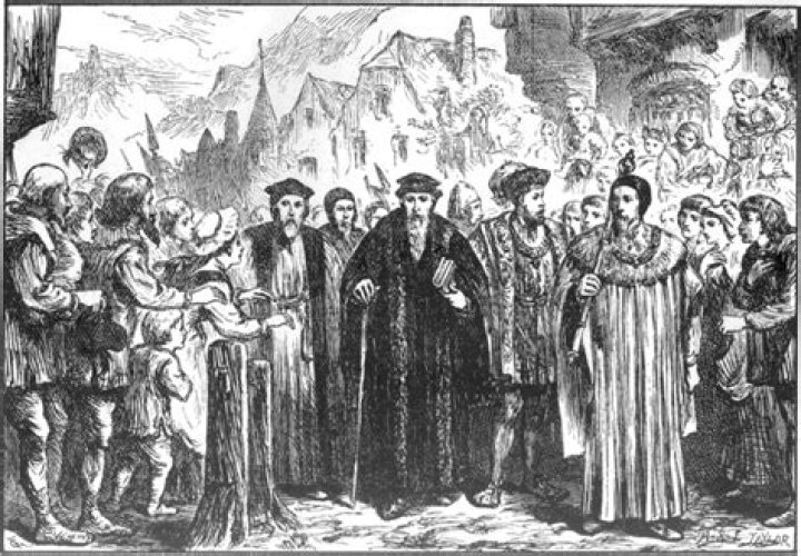 What year did John Calvin establish a theocracy in Geneva Switzerland?