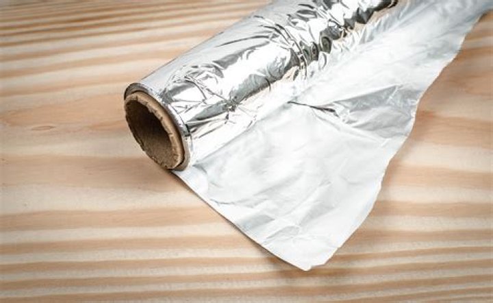 Which side of aluminum foil does not stick?