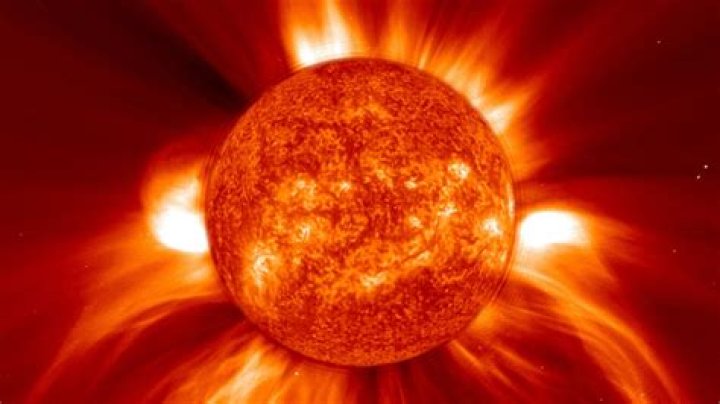 Why do coronal mass ejections occur?