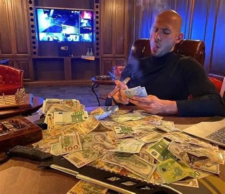 Why does Cyrano throw a bag of money on stage?